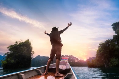 man raised hands enjoying adventure